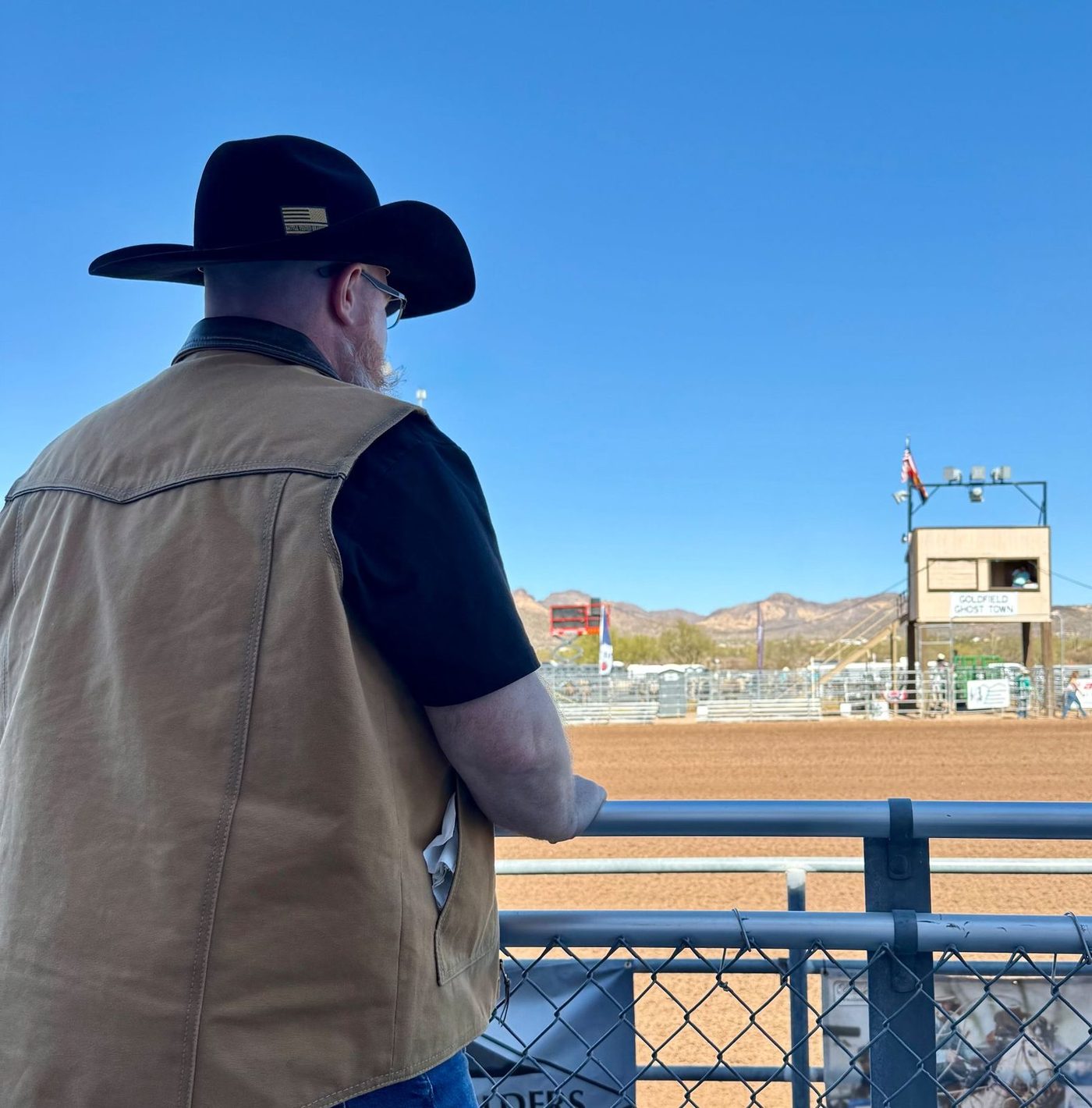 Joshua Morris working the arena railing at an Arizona rodeo